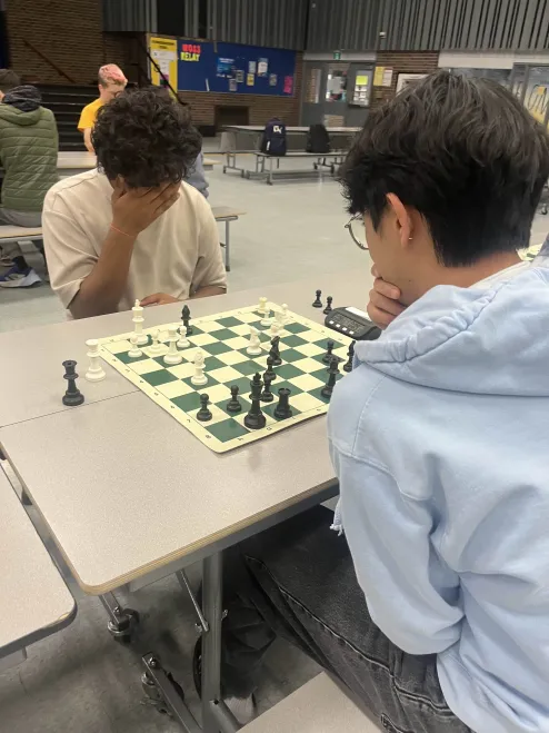 2 highschool players engaging in chess